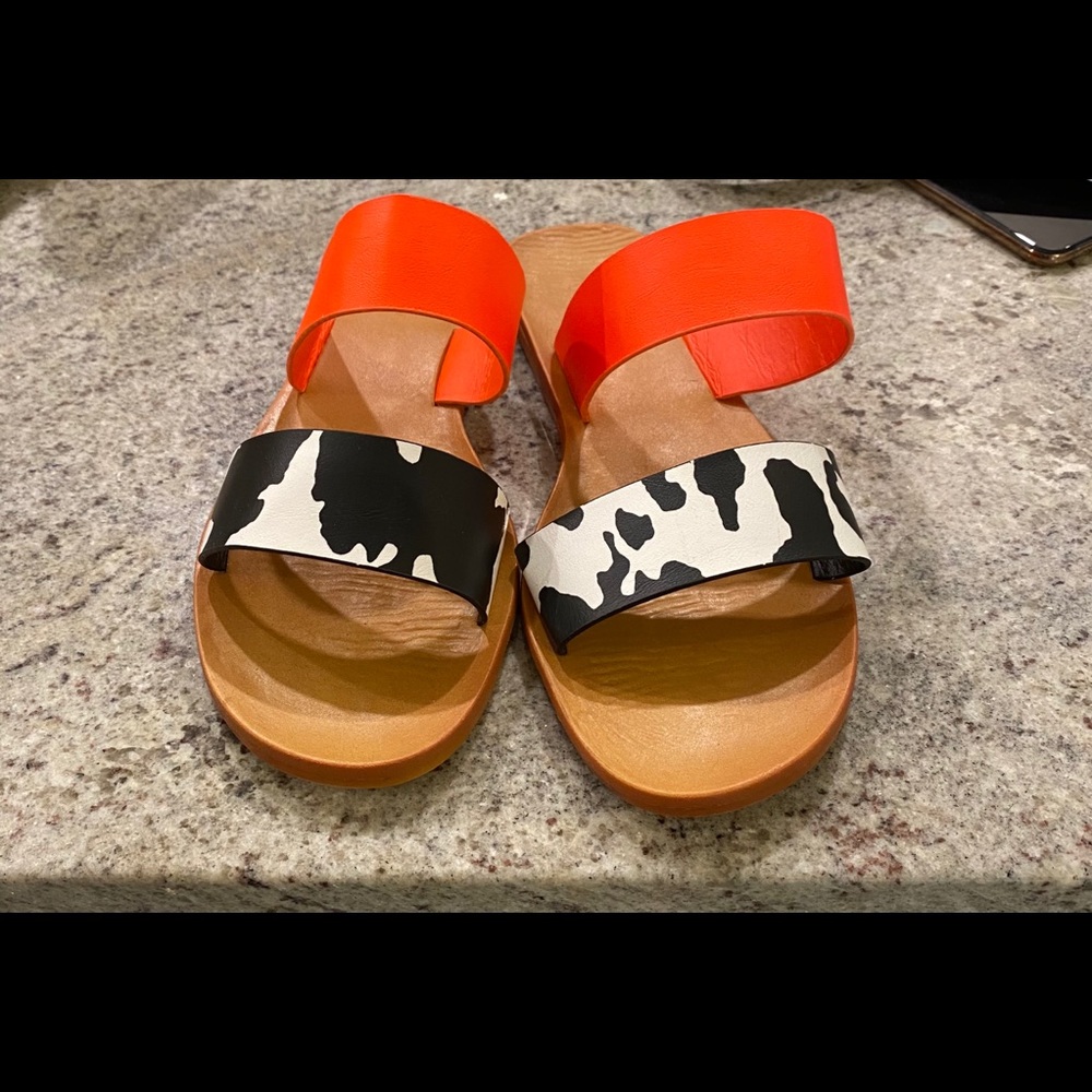 orange and cow print sandals